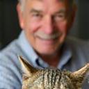 Client Paul smiling with his cat